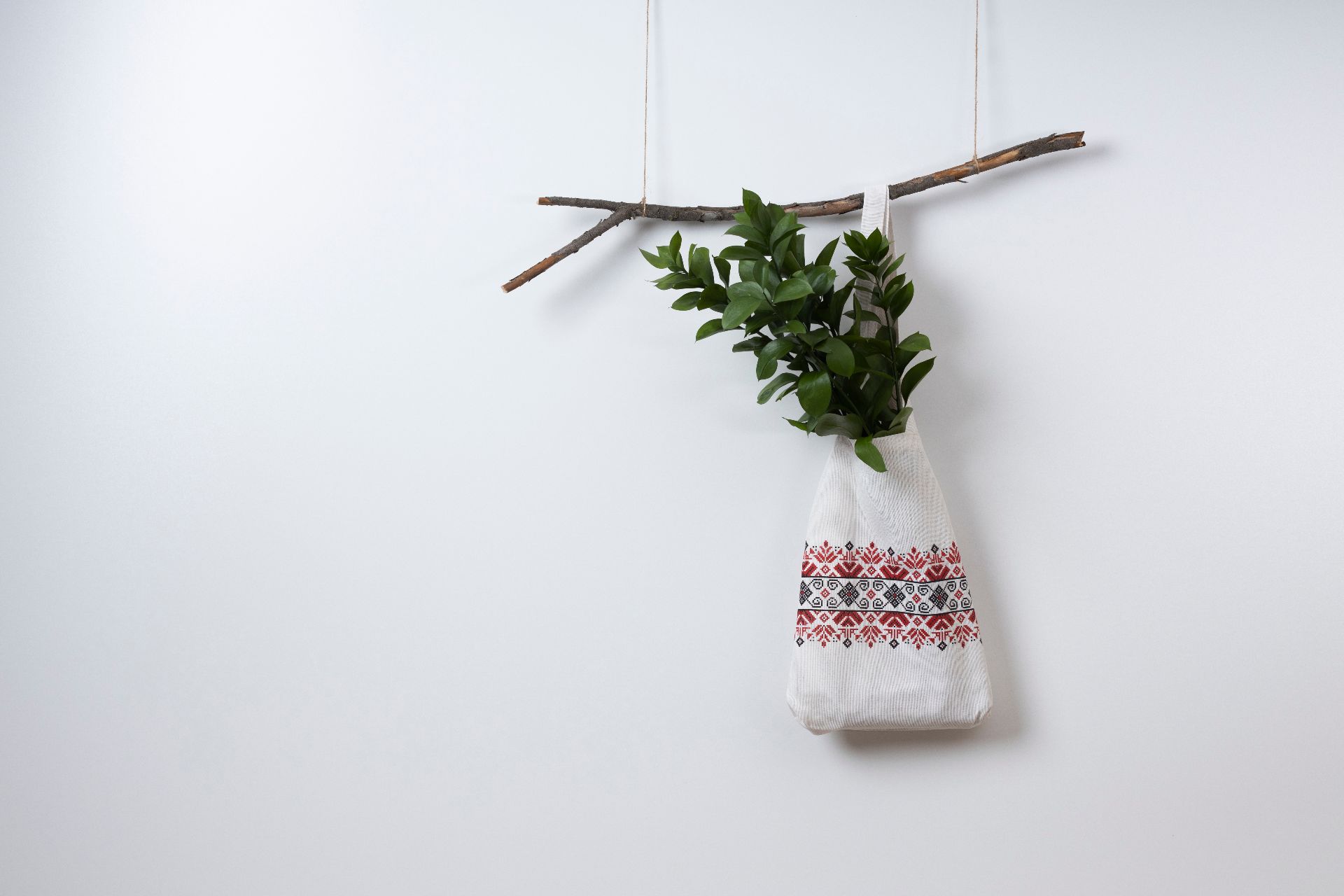 embroidered-bag-hanging-branch (1).jpg